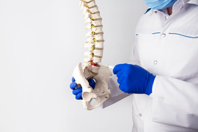 What are the causes and symptoms of a Herniated Disc?